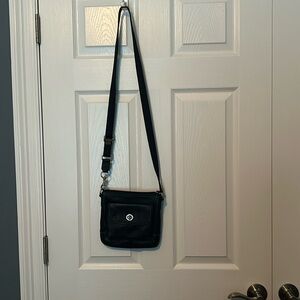 Black purse with white stitching